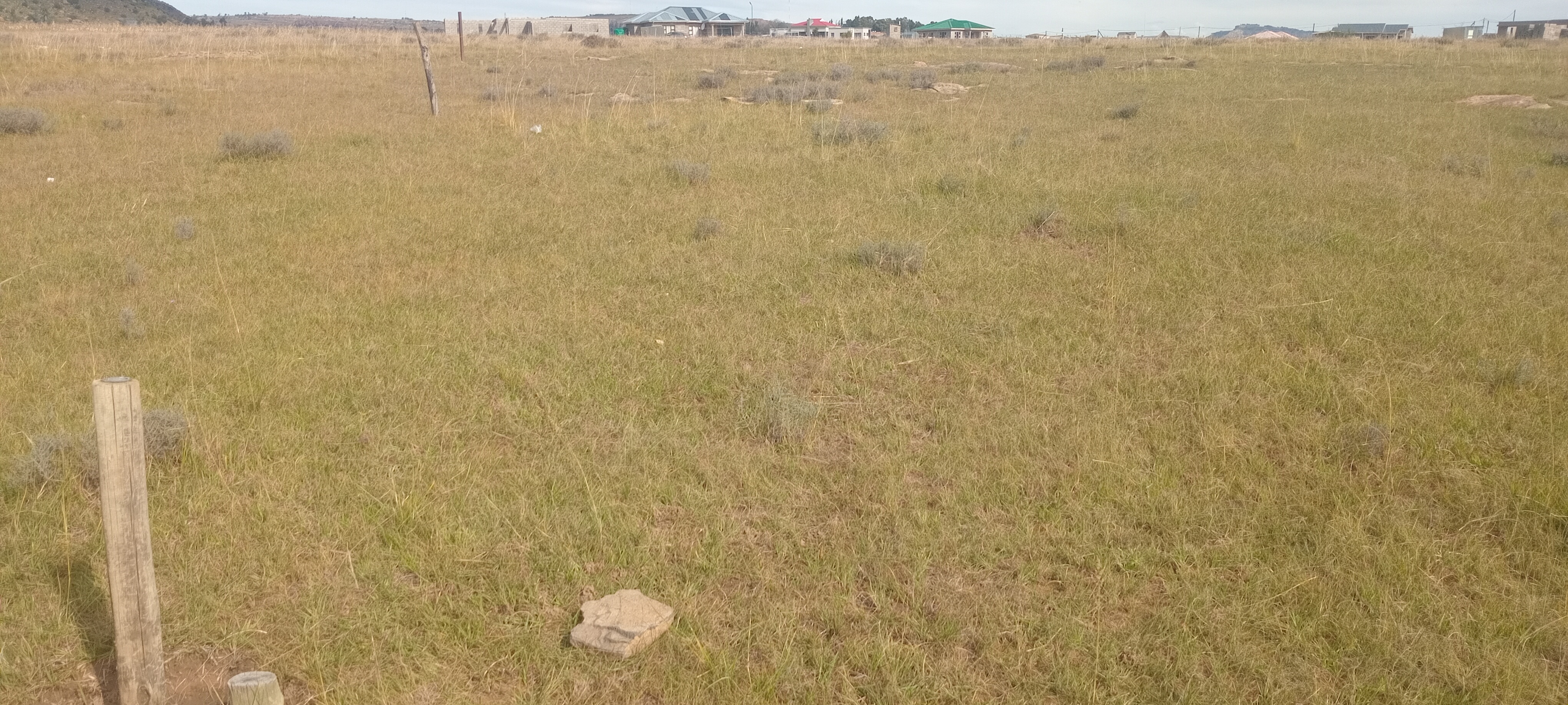 The site is at Ha Foso, ha u kena le Lema. On the road to Lesotho Housing, turn right where there is a board for Cleketseng. The site is near Cleketseng. Size is 30m x 30m.